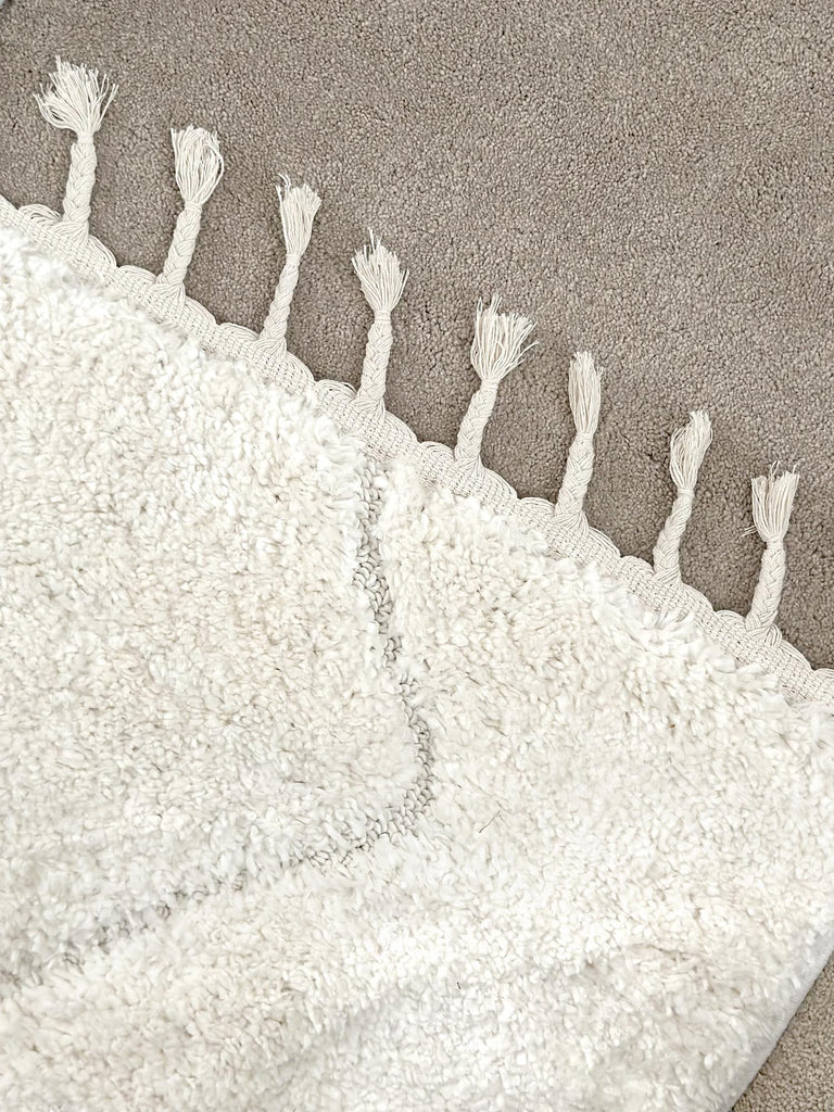 Calypso Ivory Cream Textured Tribal Tassel Rug