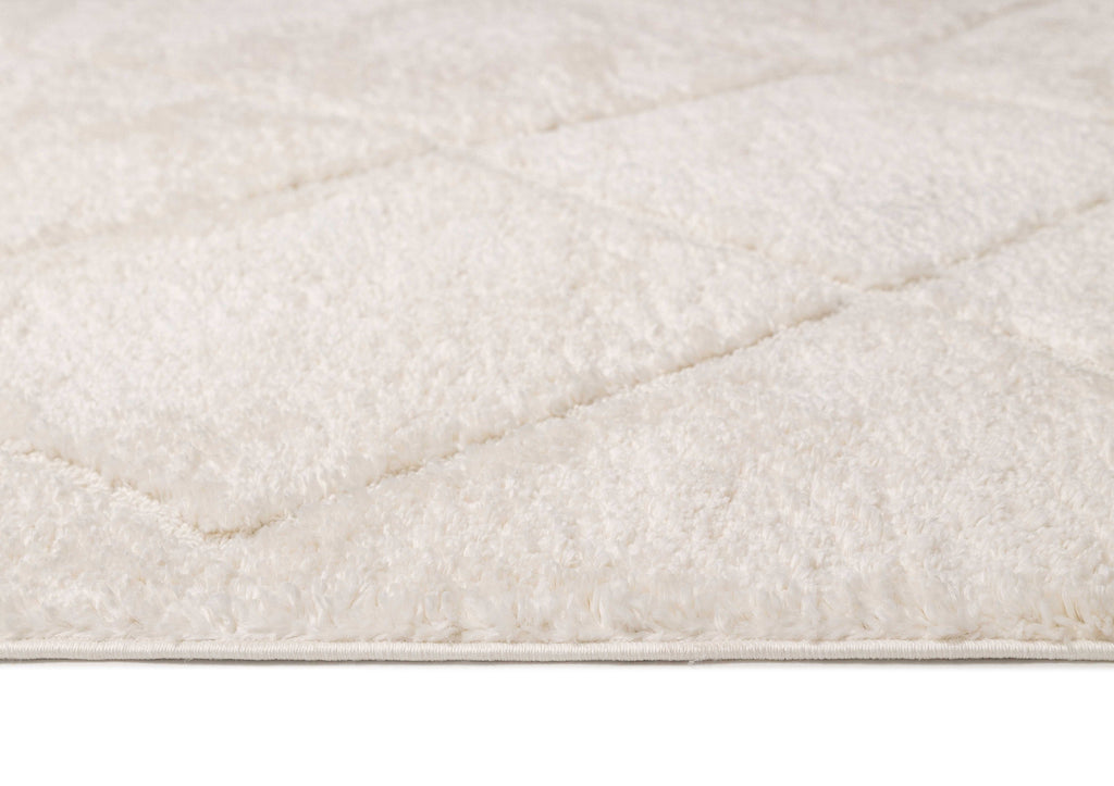 Calypso Ivory Cream Textured Tribal Tassel Rug