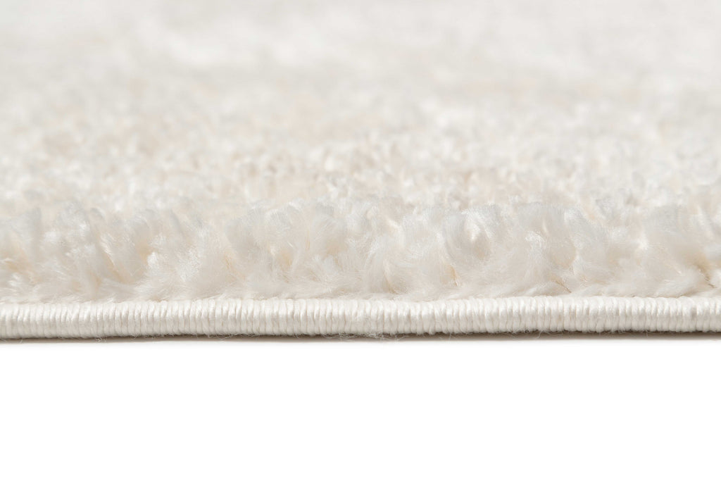 Serena Ivory Cream Textured Tassel Rug