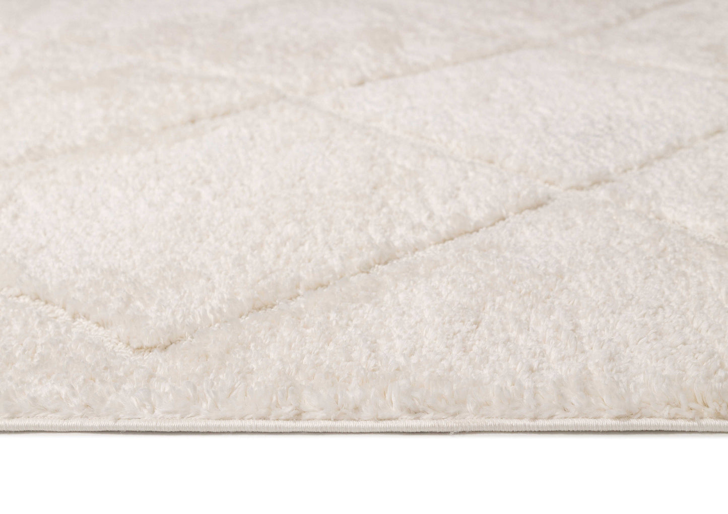 Calypso Ivory Cream Textured Tribal Tassel Rug
