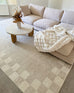 Eliora Grey Checkered Border Washable Rug